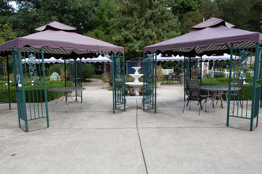 A serene outdoor space featuring two gazebos and a central fountain, perfect for relaxation.
