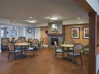 Cozy dining area with a fireplace and comfortable seating.