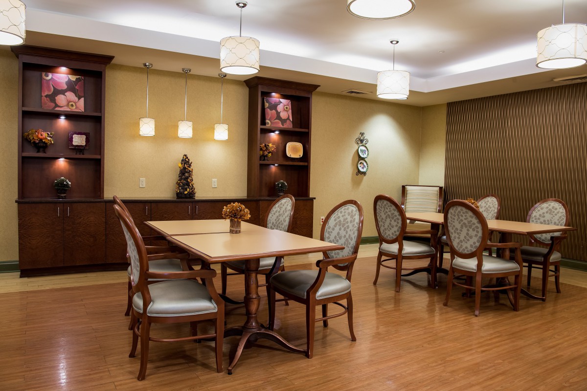 A well-lit dining area with elegant furniture and stylish decor.