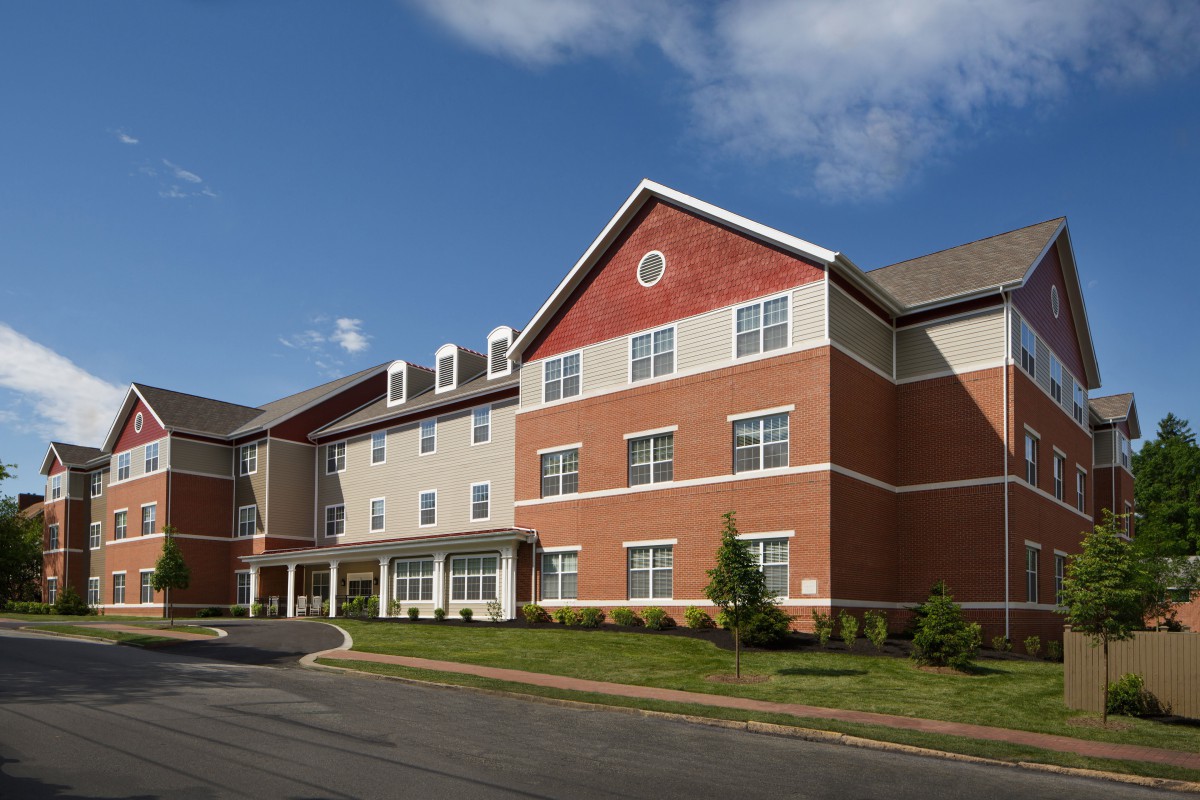 A modern brick building under a clear blue sky.