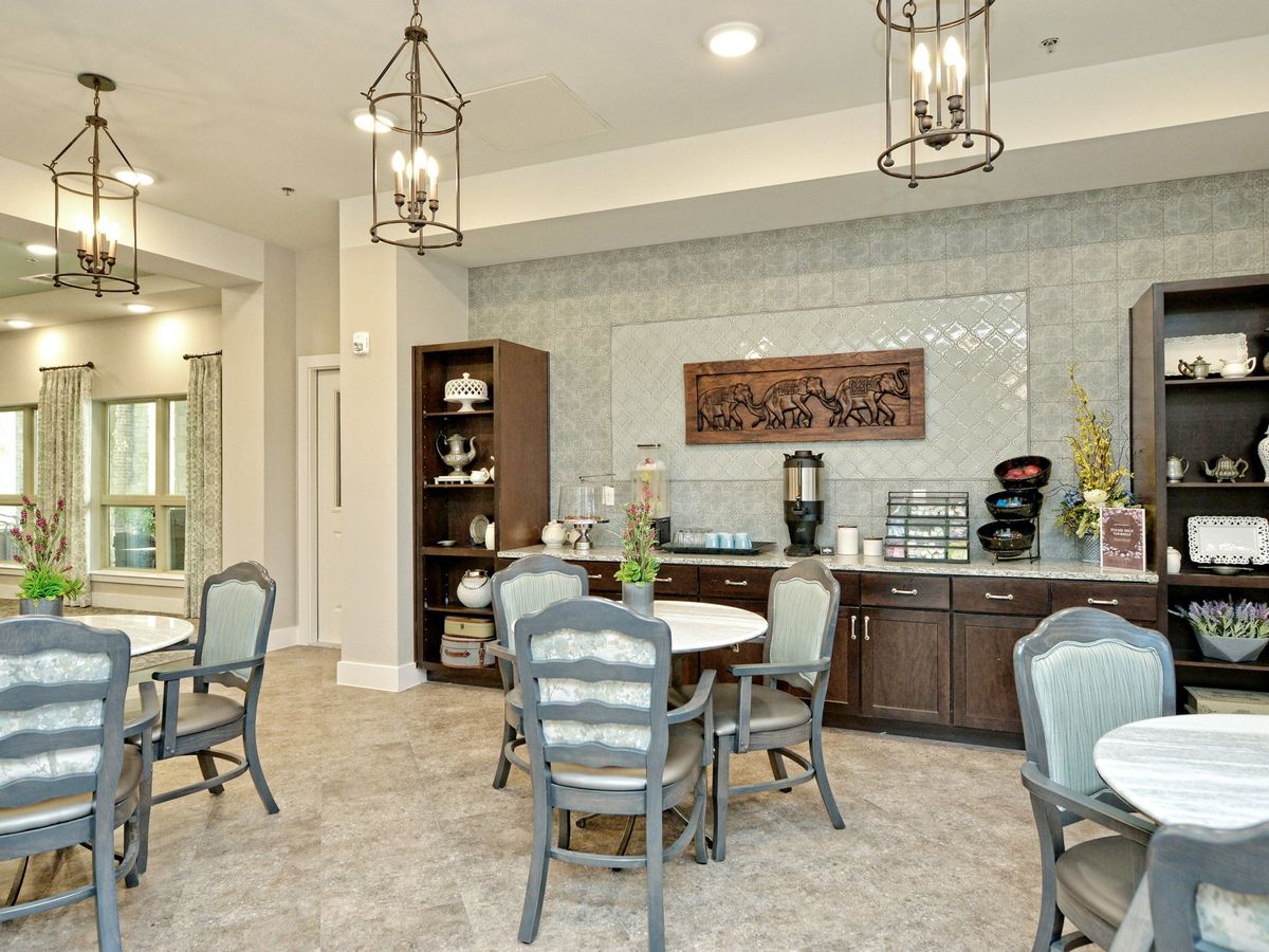 A well-appointed dining area with elegant decor and a beverage station.