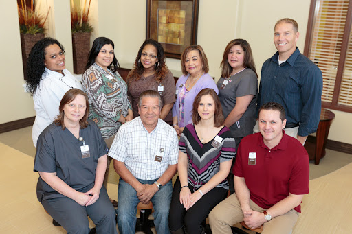 A team gathering, showcasing a diverse group of professionals posing together.
