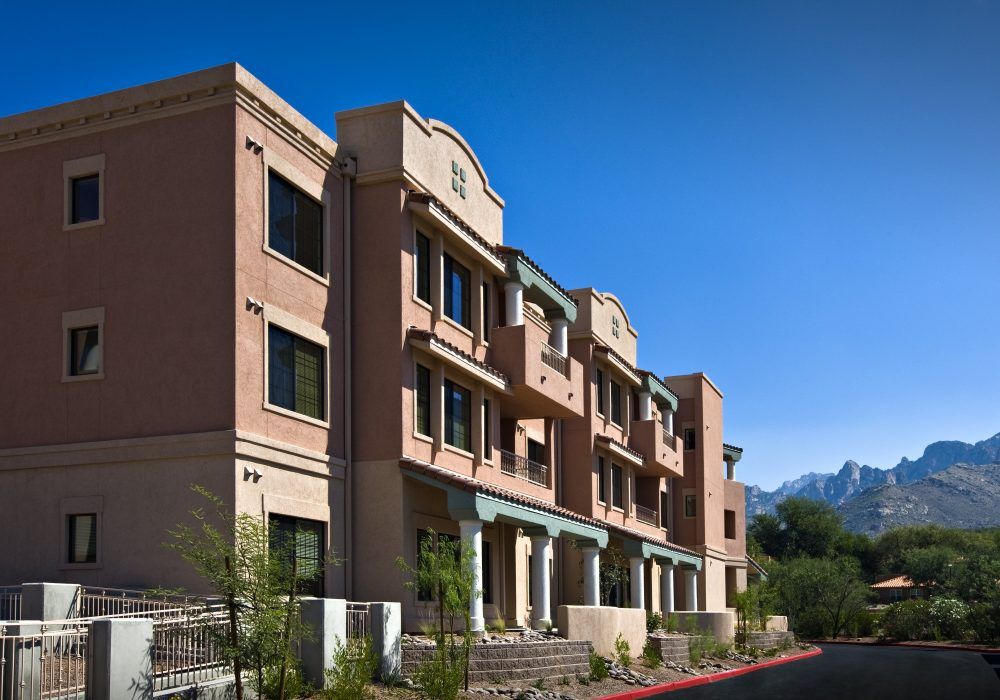 Modern apartment building under a clear blue sky.