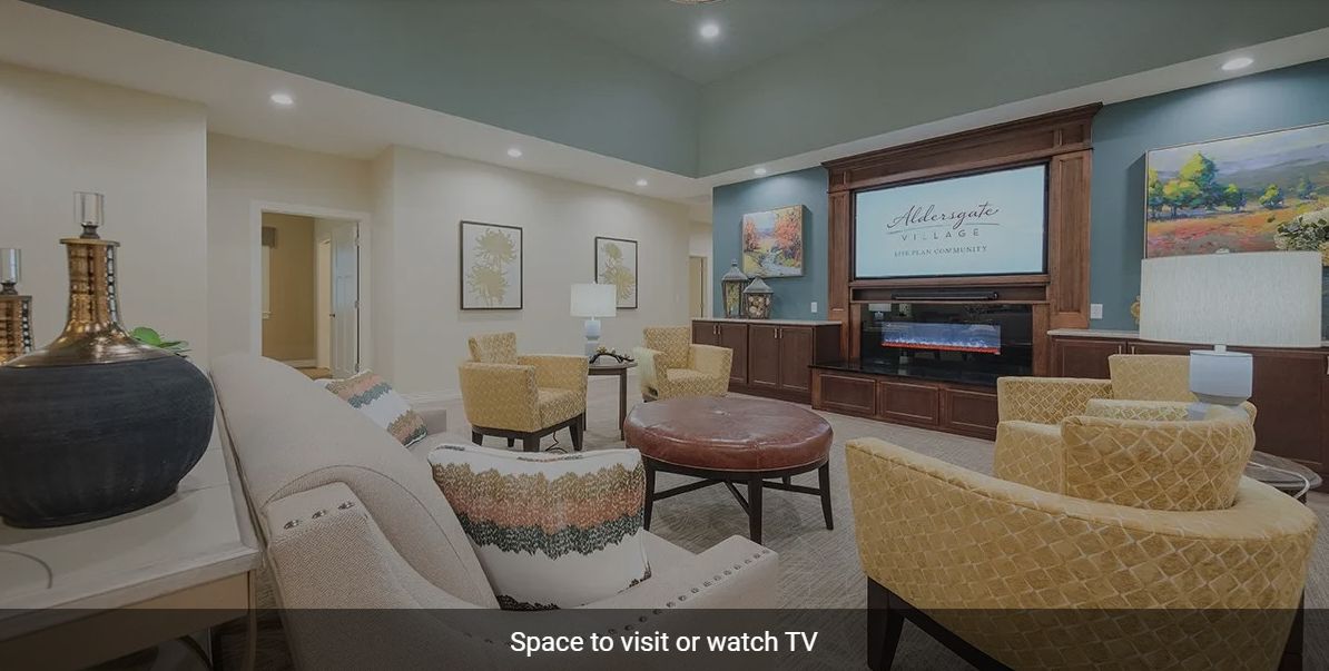 A cozy living space with comfortable seating and a large TV for entertainment.