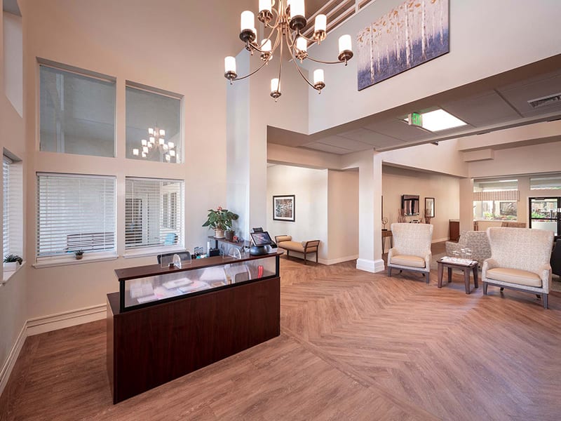 A modern reception area with elegant lighting and comfortable seating.