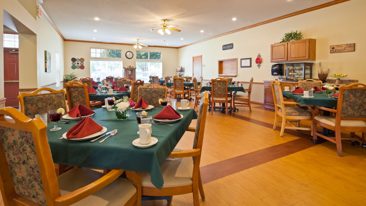 A well-arranged dining room with tables set for service.