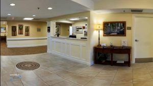 A welcoming reception area with a desk and tiled floor.