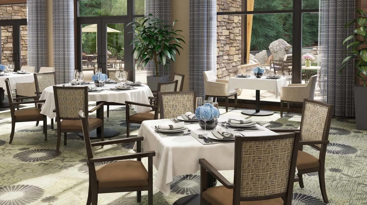 Elegant restaurant interior with neatly arranged tables and chairs.