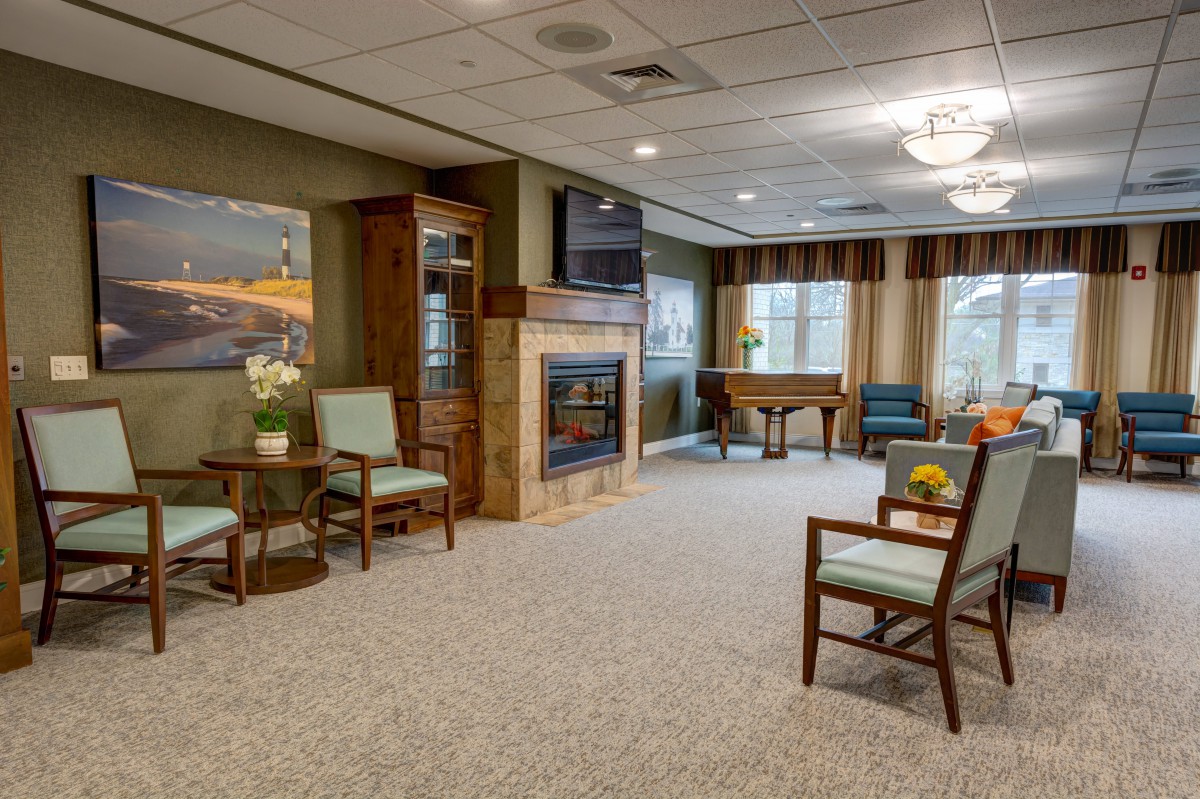 A cozy living room with comfortable seating, a fireplace, and tasteful decor.