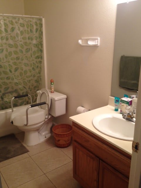 A clean bathroom with a sink, toilet, and bathtub.