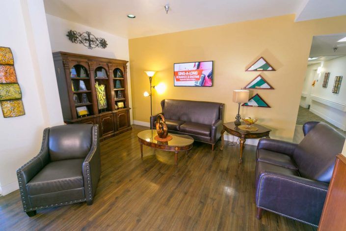 A cozy living room with comfortable seating and elegant decor.