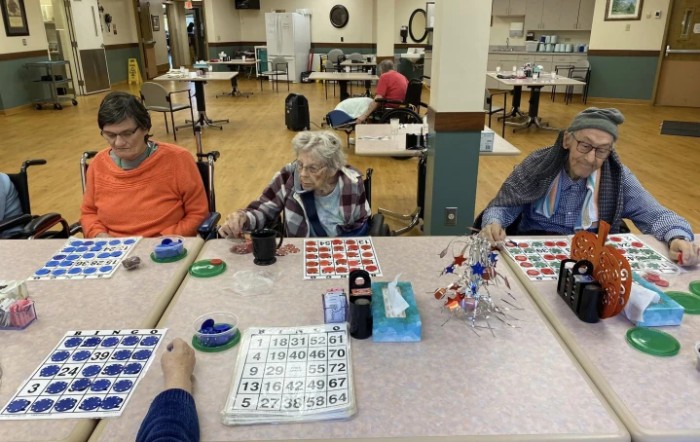 A group of seniors playing bingo at a community center.