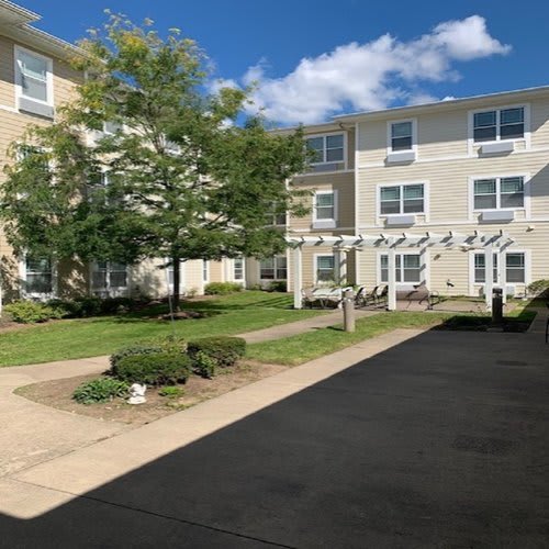 A sunny day at a residential apartment complex with well-maintained landscaping.