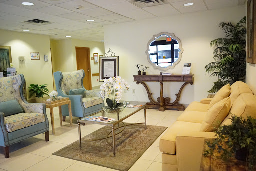 A stylish and inviting waiting room featuring comfortable furniture and elegant decor.