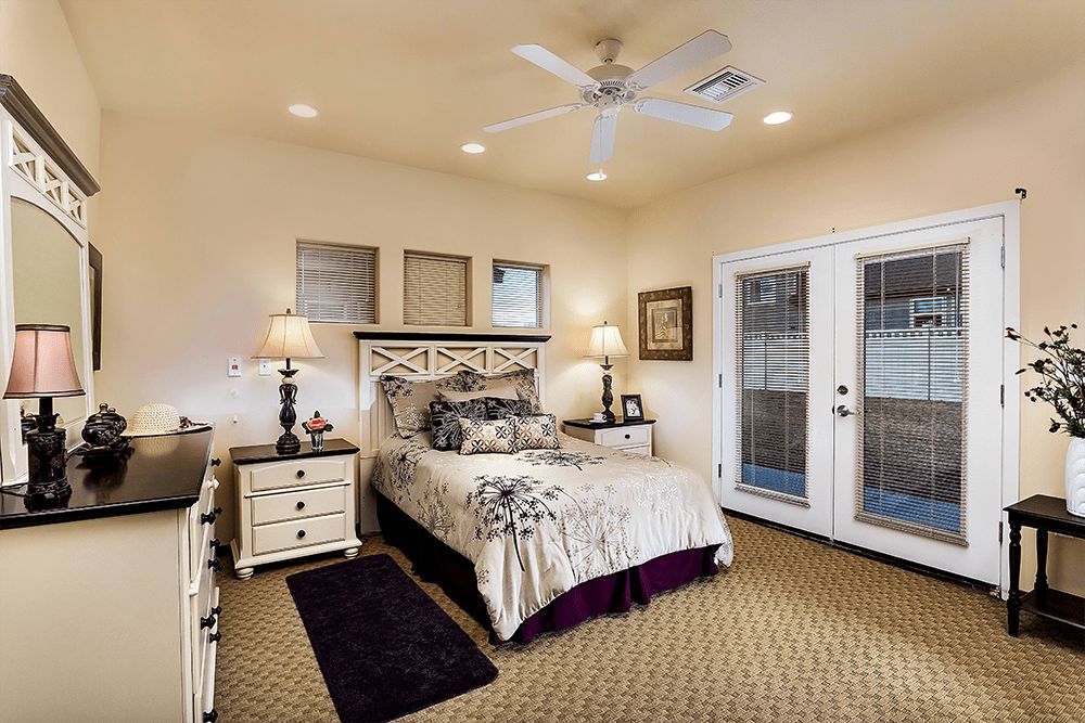 A cozy bedroom with elegant furniture and soft lighting.