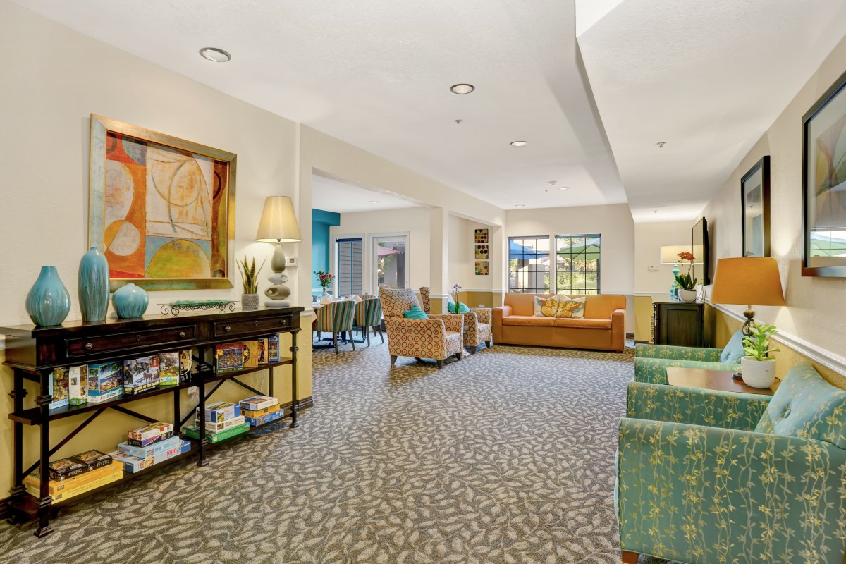 A cozy lounge area with comfortable seating and warm decor.