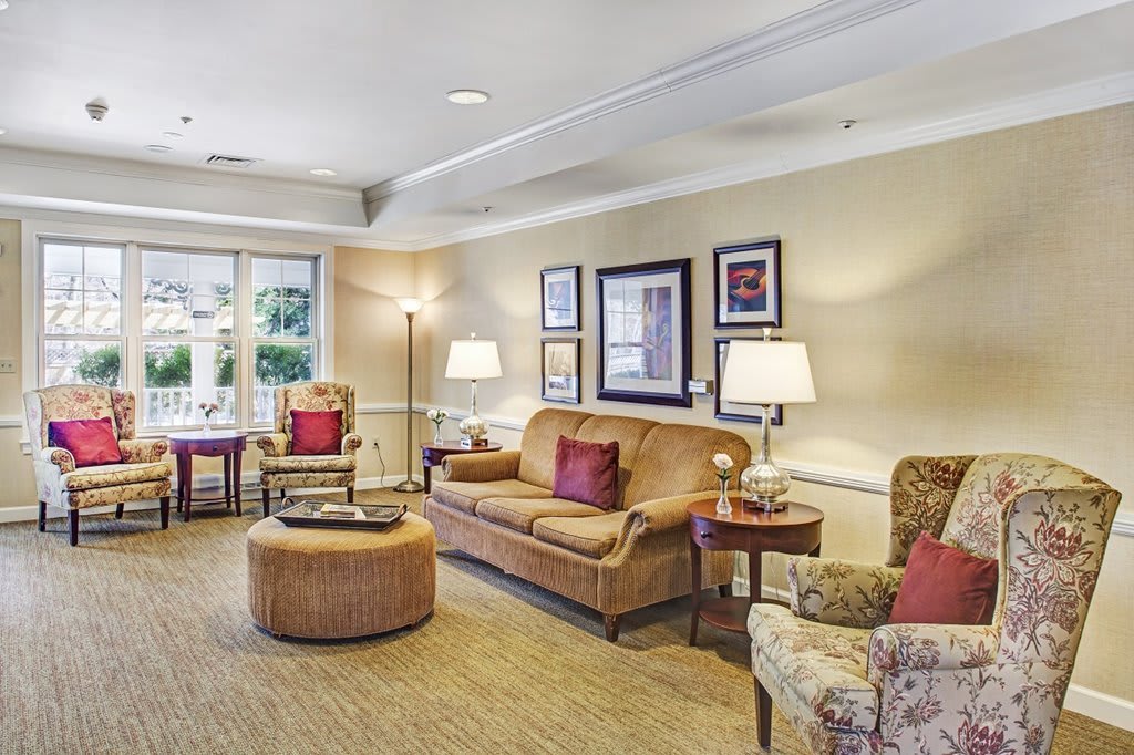 A cozy and elegantly furnished living room with comfortable seating and tasteful decor.
