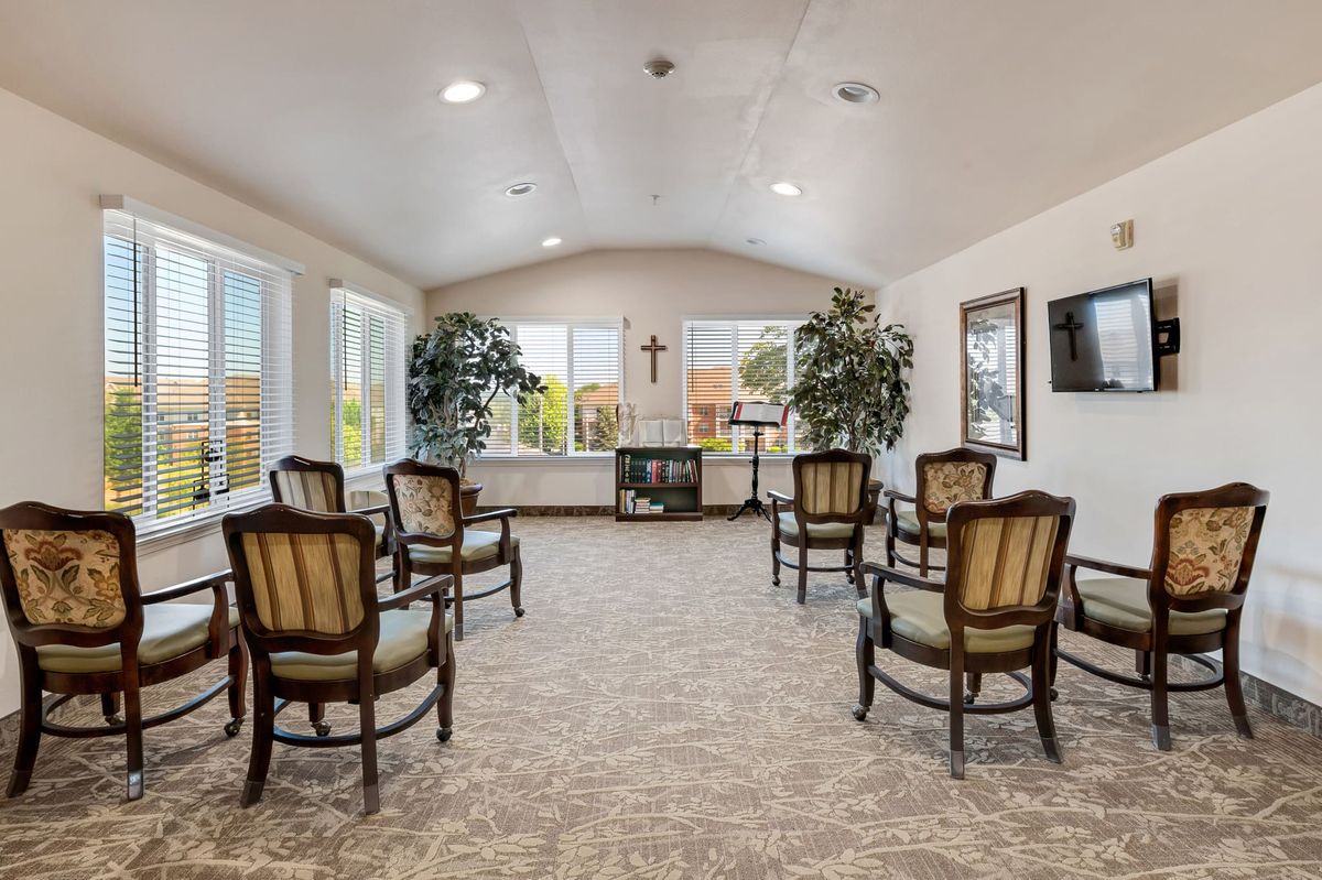 A well-lit meeting room with arranged seating and decorative elements.
