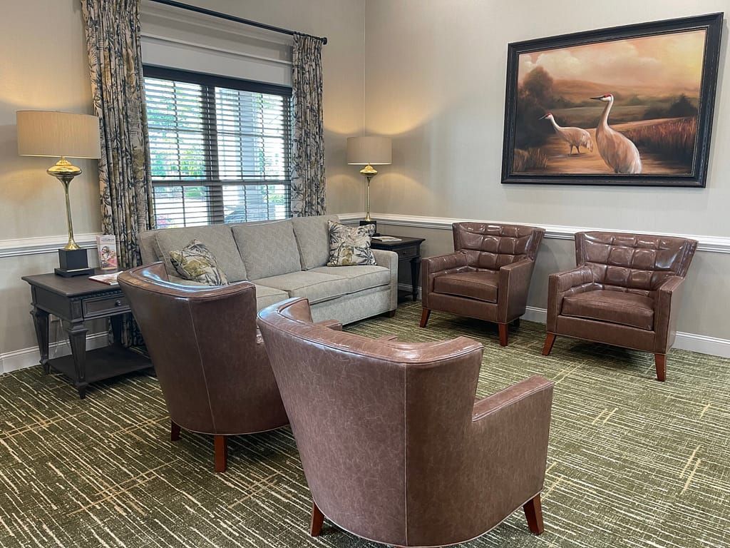 A cozy living room with comfortable seating and elegant decor.