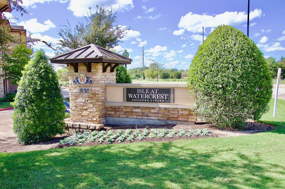 Entrance sign for The Villas at Willow Point, surrounded by greenery and landscaping.
