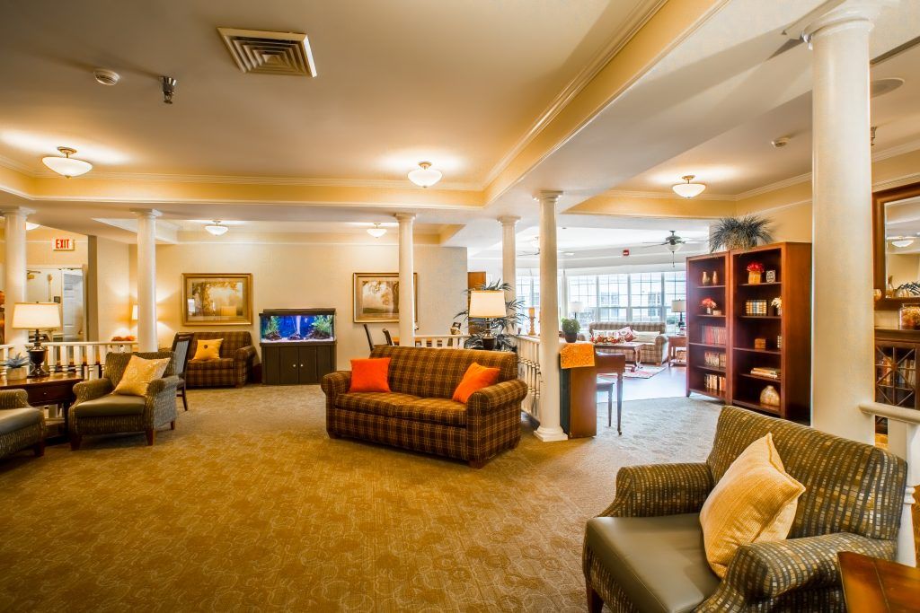 A cozy living room with comfortable sofas, warm lighting, and modern decor.
