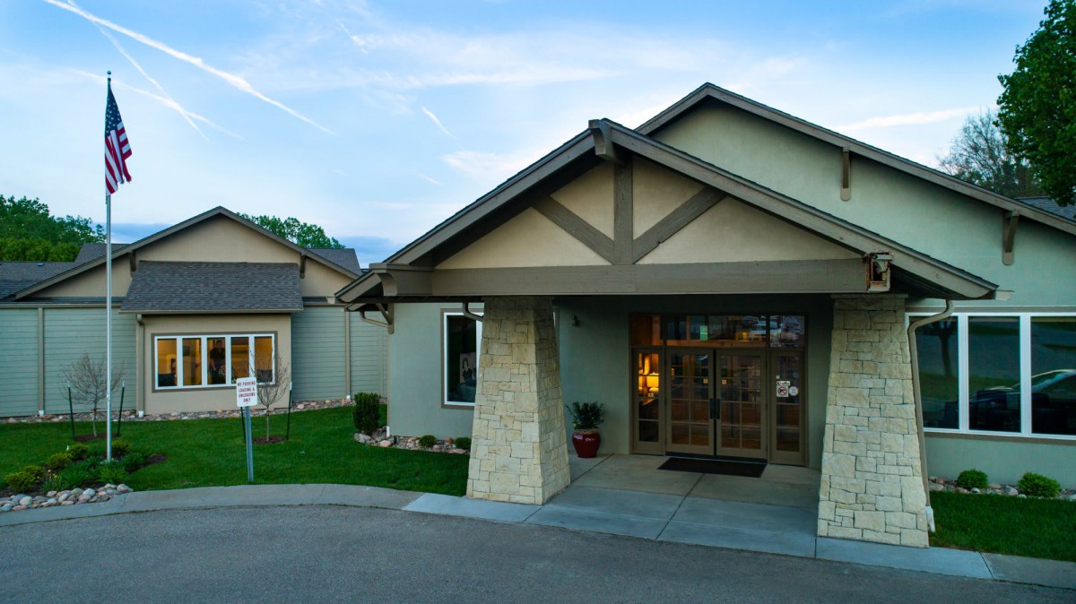 Front view of a modern residential house with a landscaped yard.
