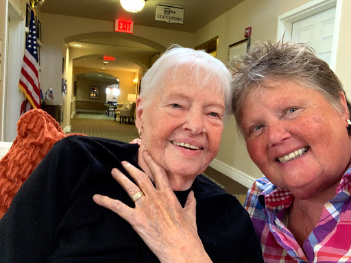 A joyful moment captured in a selfie, showcasing the warm bond between two friends.