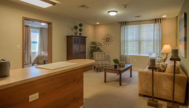 A cozy office reception area with comfortable seating and decorative elements.