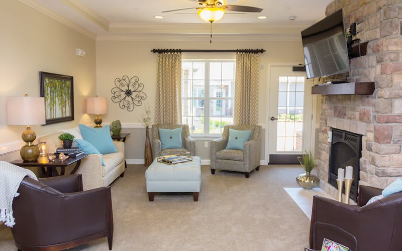 A cozy living room with comfortable seating and elegant decor.