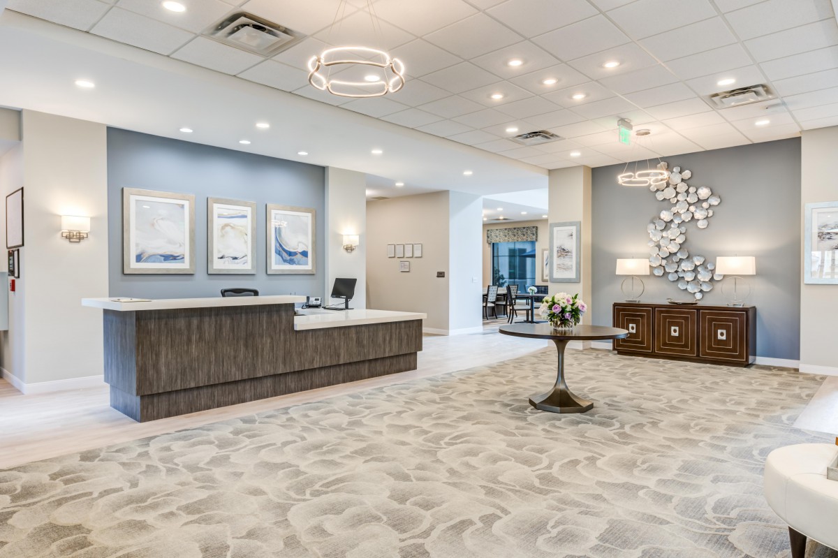A modern reception area with stylish decor and comfortable seating.