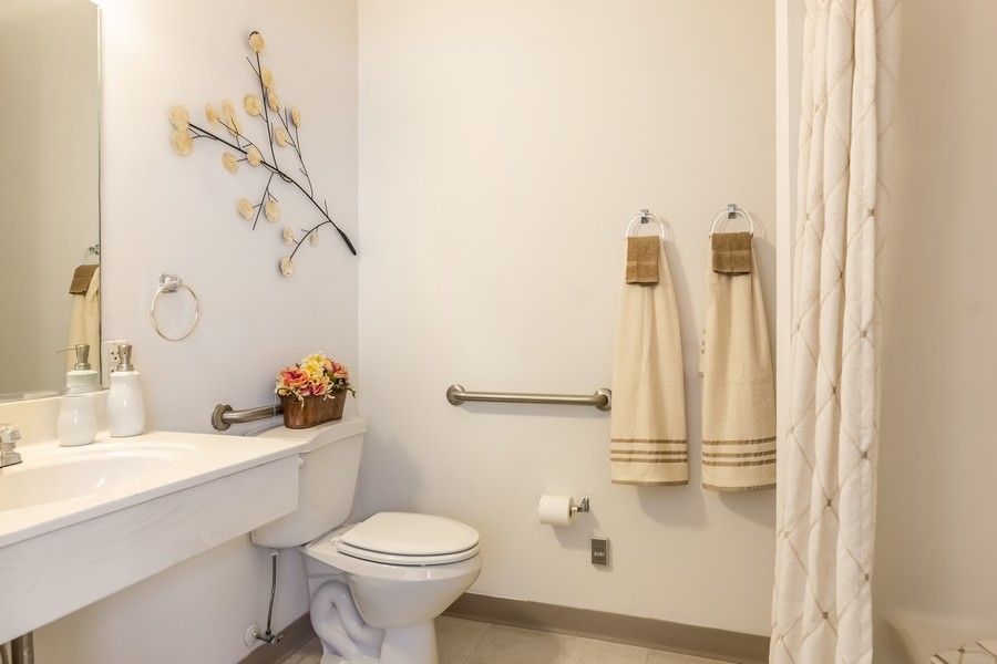 A clean and well-organized bathroom with accessible features.