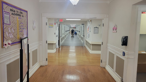 A long, empty corridor in a healthcare facility.