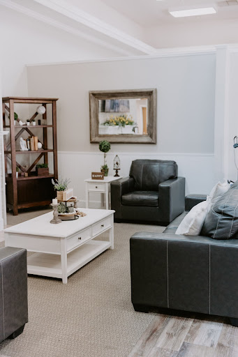 A cozy and modern living room setup featuring stylish furniture and decorative accents.