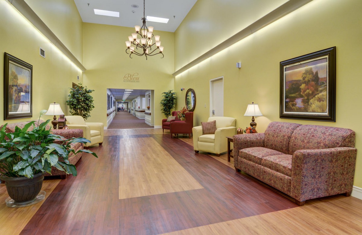 A spacious lobby with comfortable seating, elegant lighting, and decorative elements.