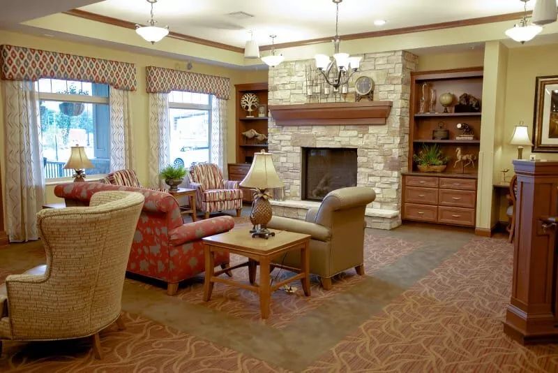 A cozy living room featuring a fireplace and comfortable seating arrangement.
