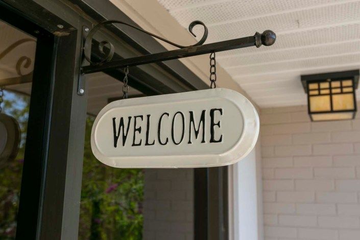A welcoming sign hanging at the entrance.