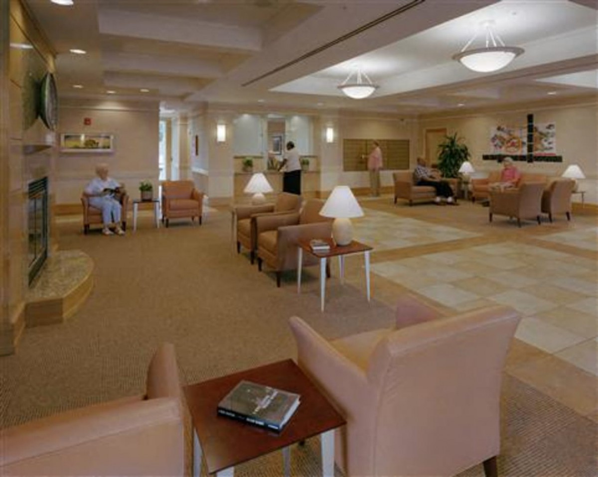 A spacious and comfortable lobby area with various seating arrangements and soft lighting.