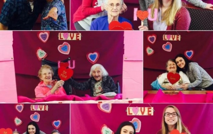 Community Valentine's Day celebration with heart decorations and smiles.