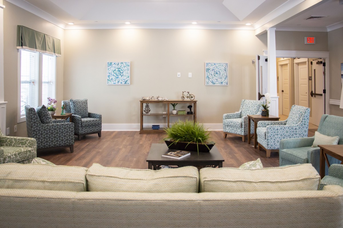 A modern living room with elegant furniture and tasteful decor.