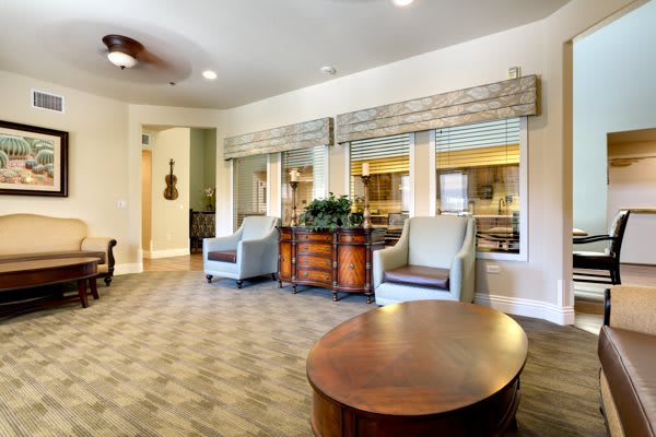 A cozy and elegant lobby with comfortable seating and decorative elements.