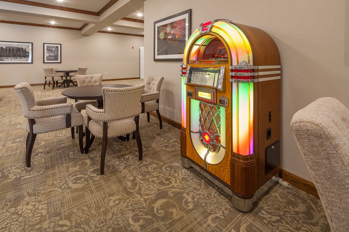 A retro jukebox in a cozy dining area.