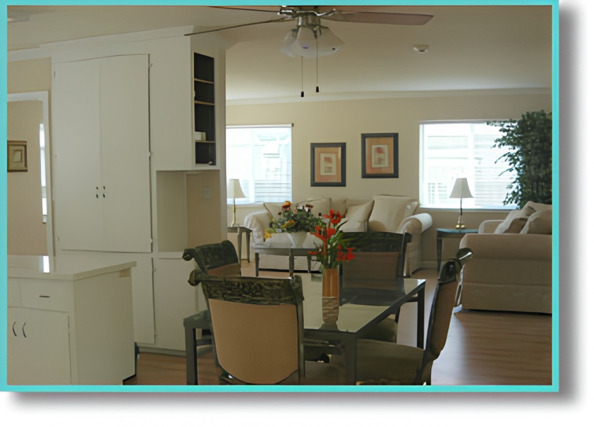 A modern living room and dining area with comfortable seating and tasteful decor.