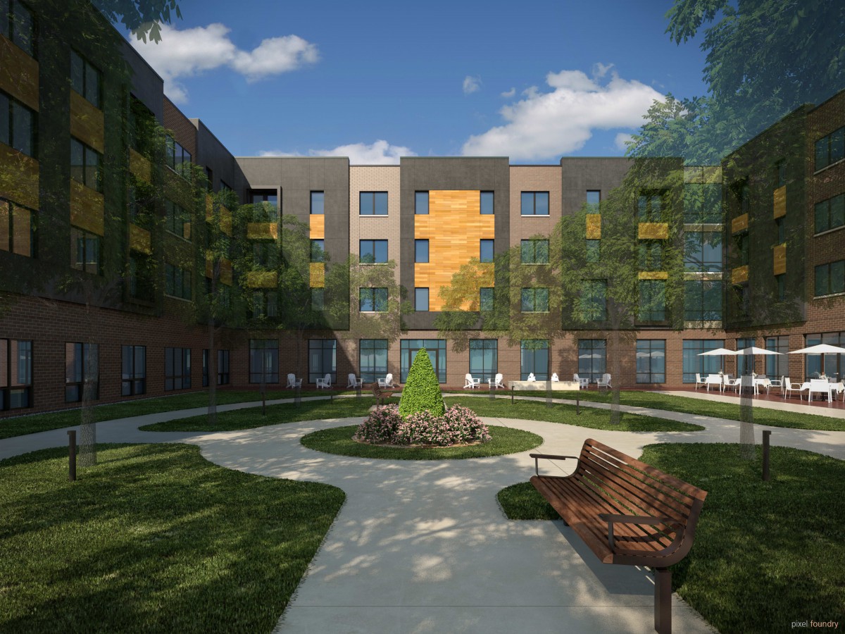 A modern apartment building with a landscaped courtyard featuring benches and a circular pathway.
