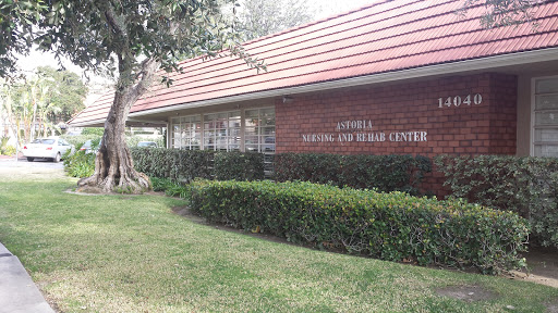 Exterior view of a health and wellness center featuring a red roof and landscaped surroundings.