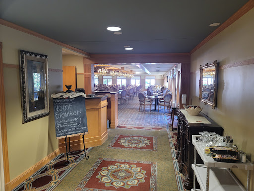 A view of the dining area from the hallway, showcasing a warm and inviting atmosphere.