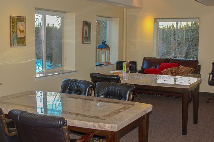 A spacious living room with a dining table and comfortable seating area.
