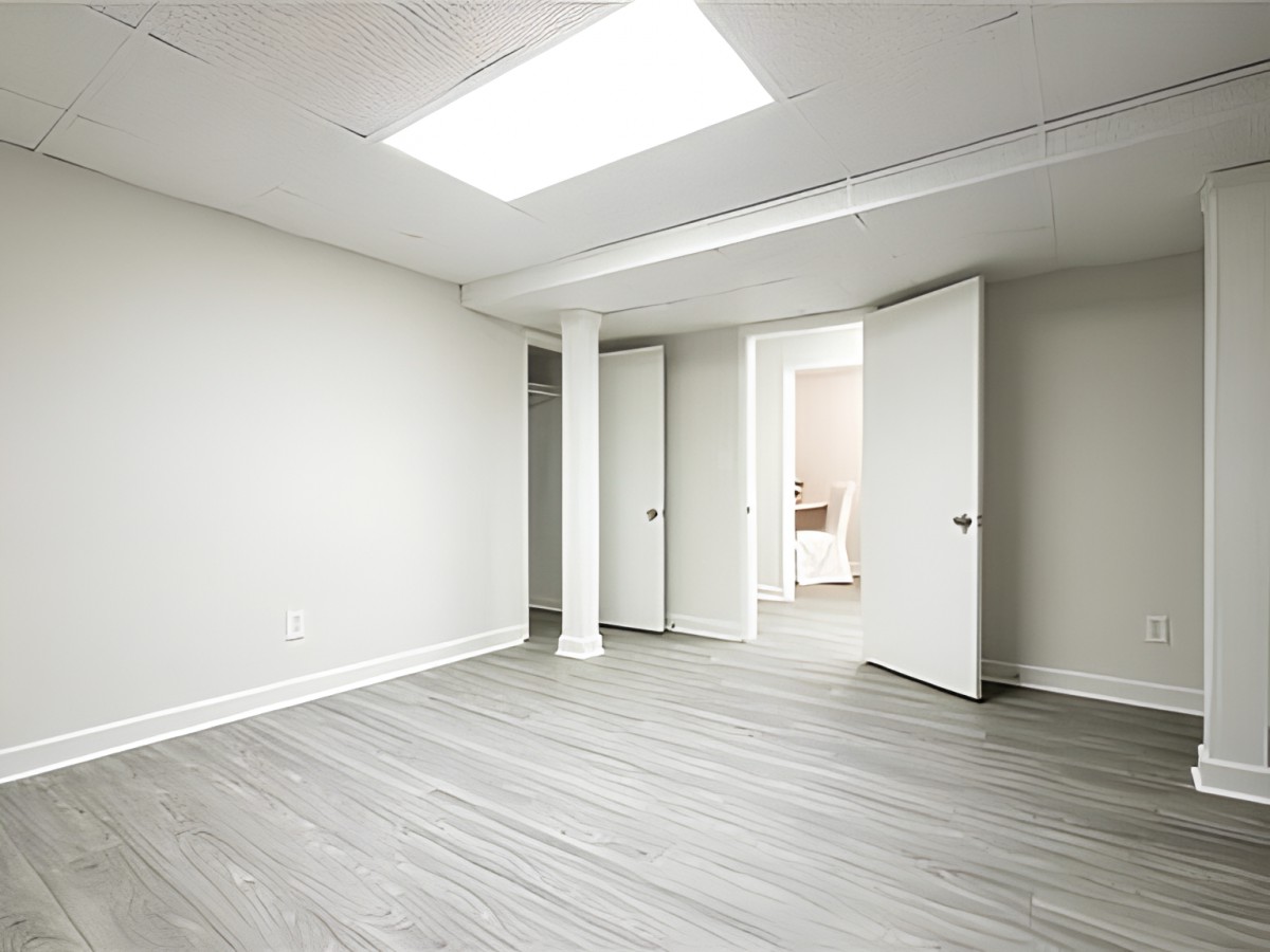 A bright, empty room with modern design and natural lighting.