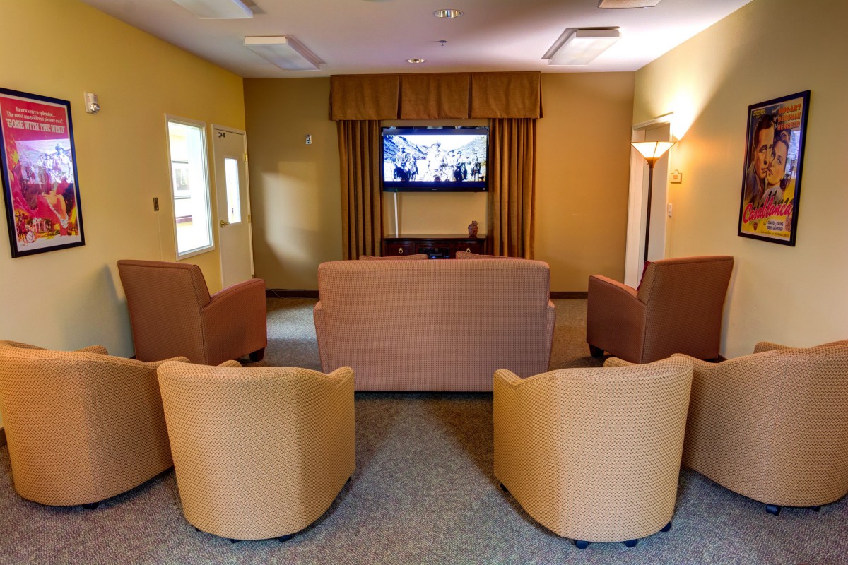 A cozy living room with comfortable seating and a television.