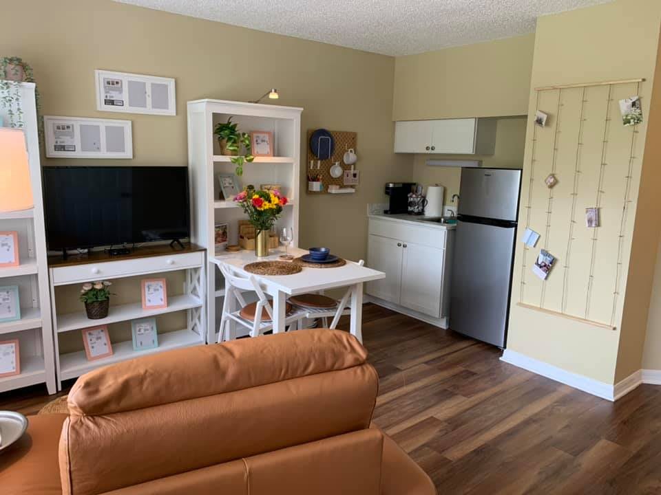 Cozy living area with a small kitchenette and dining space.