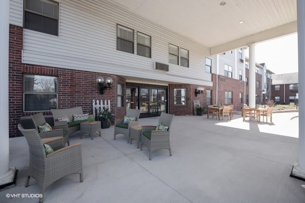 Outdoor seating area at the entrance of a building.
